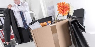 Worker packing up his belongings after being fired.