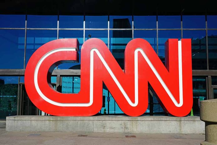 1284372034 featured image Red CNN logo outside building entrance.
