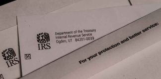 IRS letters and envelopes on a table.