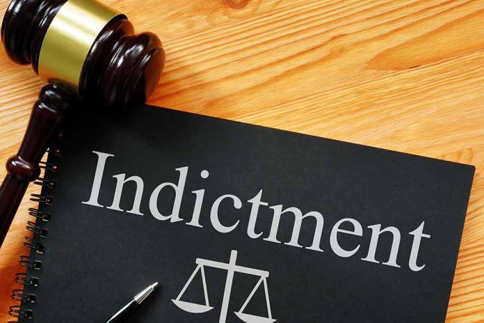 2138821999 featured image Gavel next to indictment document on table