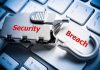 Silver lock labeled Security on keyboard Breach key