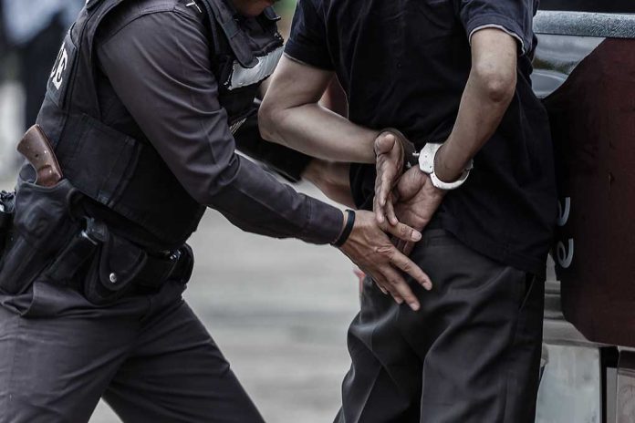 665013085 featured image Police officer handcuffing an individual behind their back