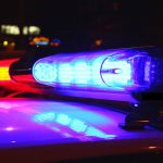 Red and blue police car lights at night