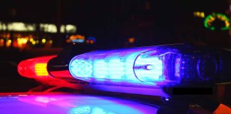 Red and blue police car lights at night