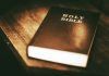 A Holy Bible on a wooden table