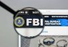 "FBI website shown through magnifying glass."