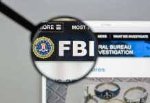 "FBI website shown through magnifying glass."