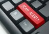 Closeup of keyboard with red SCAM ALERT key