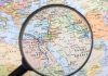 Magnifying glass focused on the Middle East map