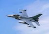Jet fighter- flying through clear blue sky