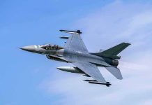 Jet fighter- flying through clear blue sky