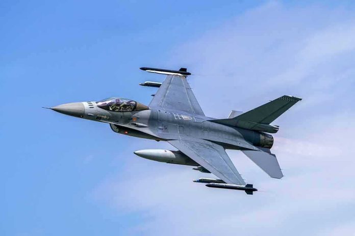 Jet fighter- flying through clear blue sky