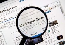 Magnifying glass over The New York Times website