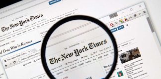 Magnifying glass over The New York Times website