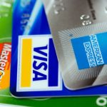 Credit cards stacked American Express Visa Mastercard