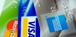 Credit cards stacked American Express Visa Mastercard