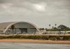 Aircraft hangar with helicopters near the beach