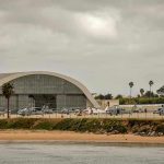 Aircraft hangar with helicopters near the beach