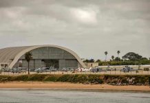 Aircraft hangar with helicopters near the beach