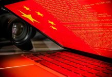 Laptop screen displaying Chinese flag and code