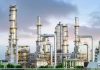 Industrial plant with metal towers and pipes
