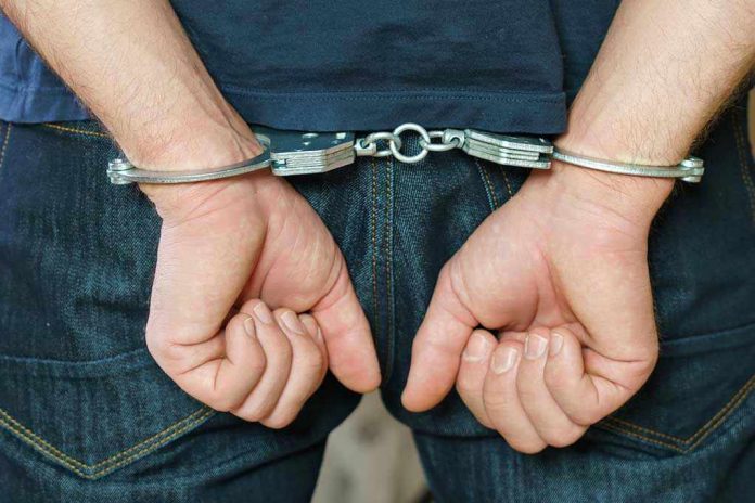 Person in handcuffs behind their back