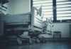 Empty hospital beds by a window