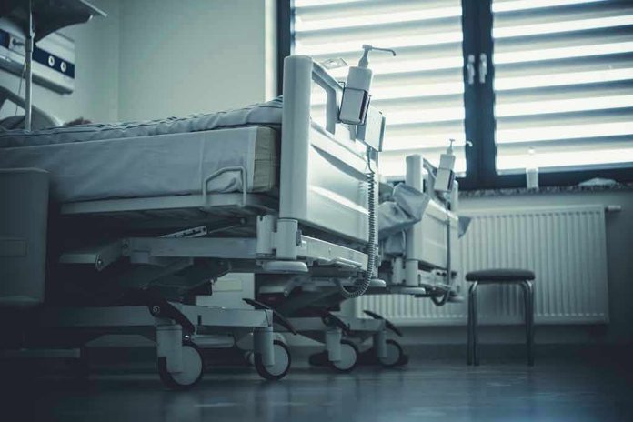 2292007351 Empty hospital beds by a window