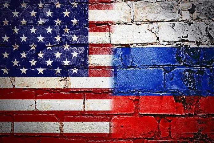 549429280 United States and Russian flags painted on brick wall