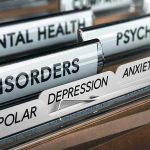 File folders labeled with mental health disorders and psychiatry