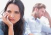 A woman looking concerned while a man appears distressed in the background