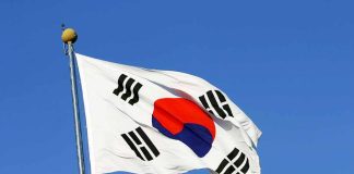 South Korean flag waving against a clear blue sky