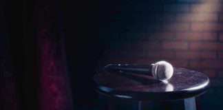 Microphone resting on a stool on stage