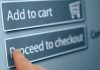 Finger tapping proceed to checkout button online