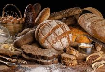 Assorted breads with seeds and baking ingredients