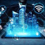 Holographic city above tablet with technology icons