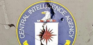 Cracked CIA logo on weathered wall