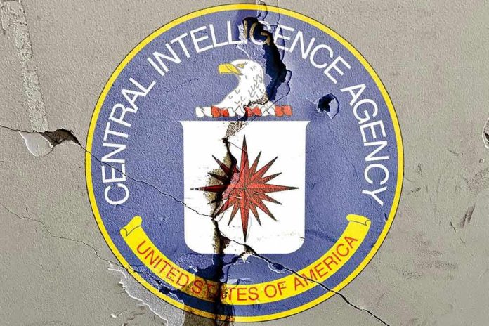 2054577161 Cracked CIA logo on weathered wall