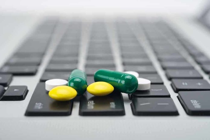 shutterstock_108587603.jpg Various colored pills scattered on a laptop keyboard