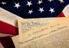 The Declaration of Independence laid on an American flag
