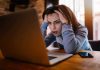 woman at laptop stressed