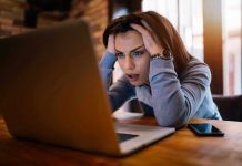 woman at laptop stressed