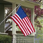 American flag hanging on a porch