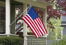 American flag hanging on a porch