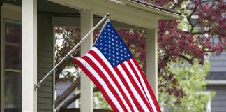 American flag hanging on a porch