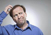 man scratching head