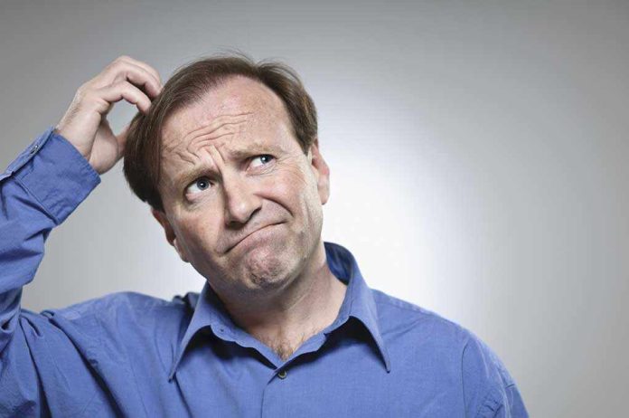 man scratching head