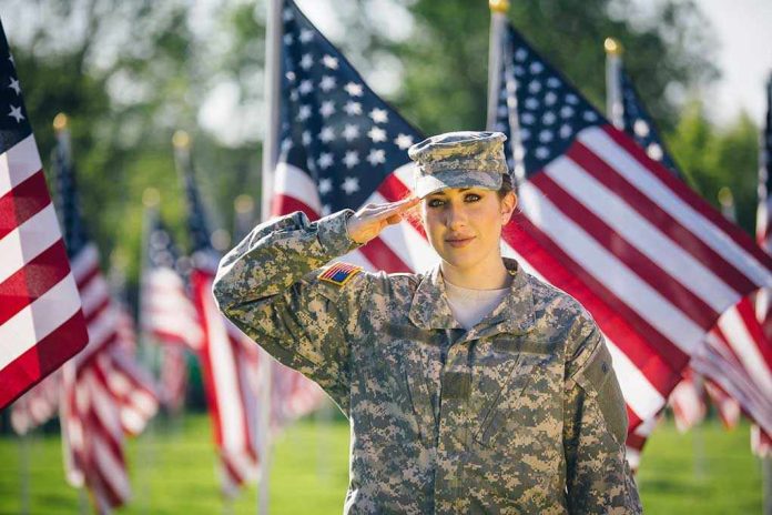 1081070213 Soldier saluting in front of American flags outdoors