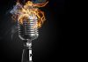 Vintage microphone with flames and smoke
