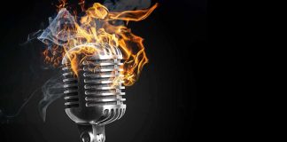 Vintage microphone with flames and smoke